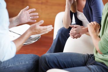 Financial, therapy and hands of couple in home with...