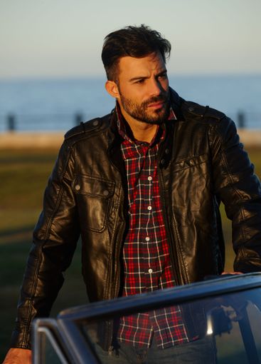 Thinking, relax and man by car at sea for solo holiday,...