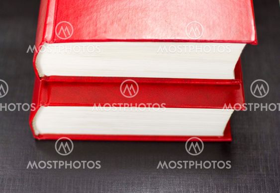 Two books on a black background