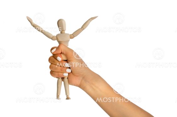 Woman hand grabs little puppet