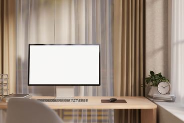 A contemporary, beige home office workspace features a...