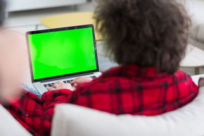 man freelancer in bathrobe working from home