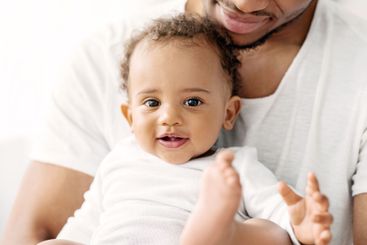 Portrait Of Adorable Black Baby Boy Spending Time With...