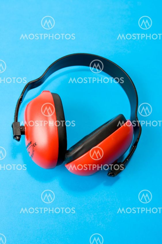 Hearing protection earmuffs on blue background