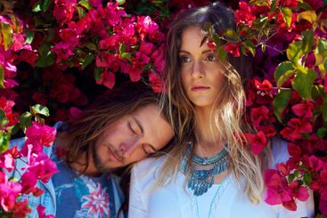 Flowers, fashion and couple by bush in garden for spring...