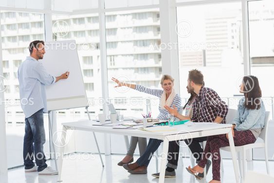 Man presenting an idea to his colleagues