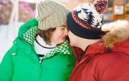 Winter plus size couple lovestory. Happy smiling man,...