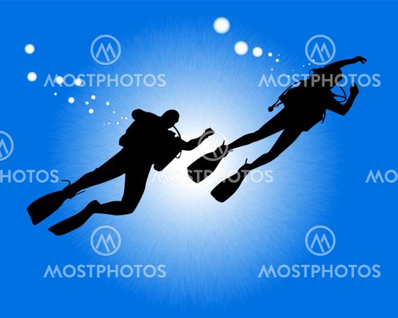 silhouettes of two divers