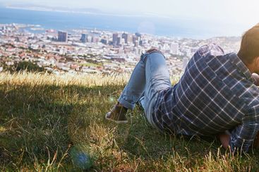 Couple, relax and outdoor with kiss for love, romantic...