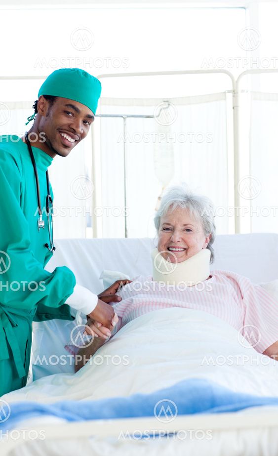 Surgeon attending a patient after an operation