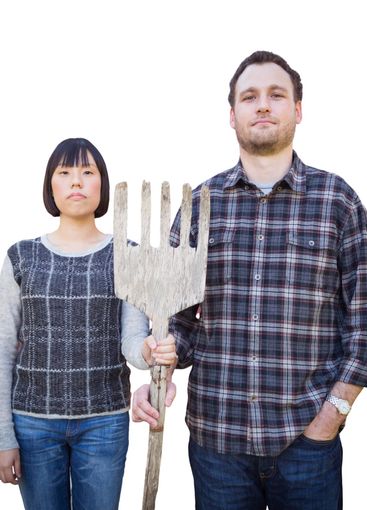 Mixed Race Chinese and Caucasian Couple Standing and...