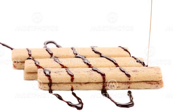 Stream chocolate on stics of biscuit.