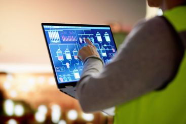 Female Engineer Monitoring Efficiency in Oil