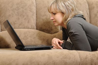 The woman working on laptop at home