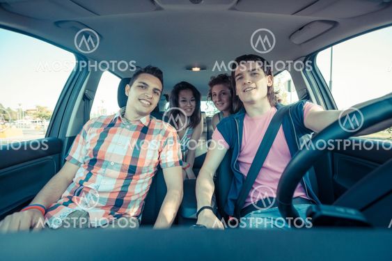 Four Friends in the Car Leaving for Vacation