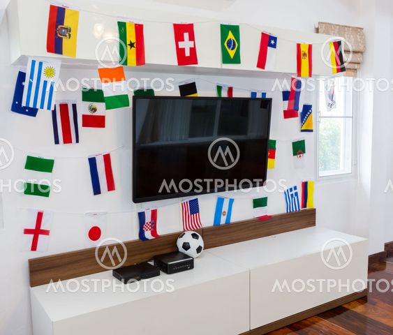 Modern room with TV and Flags for soccer championship 2014