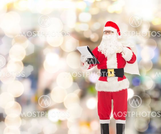 man in costume of santa claus with notepad and bag