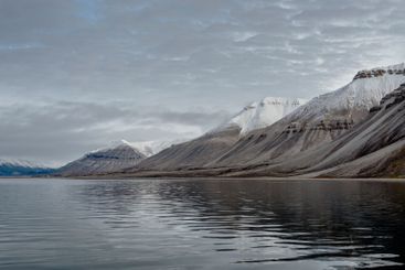 Snowy mountains and sea in Svalbard, Norway