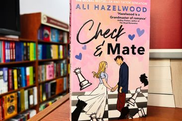 Romantic novel cover featuring chess pieces in a cozy...