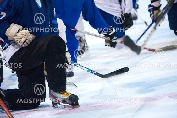 ice hockey players team meeting with trainer
