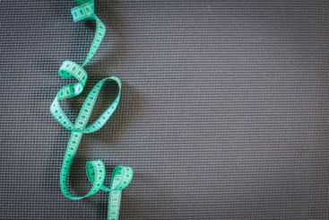 board with a tailor measuring tape