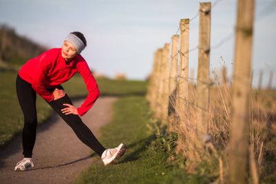 Young woman on her evening jog along the seacoast