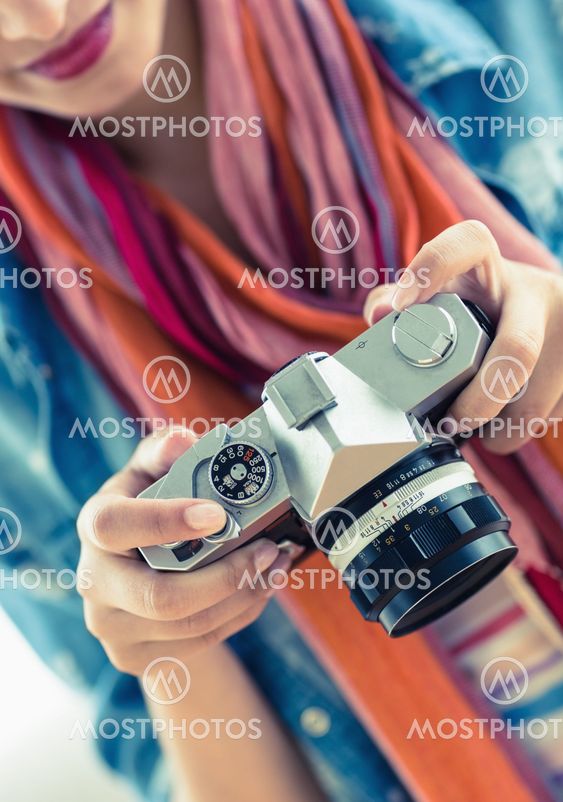 Young smiling woman looking at her camera