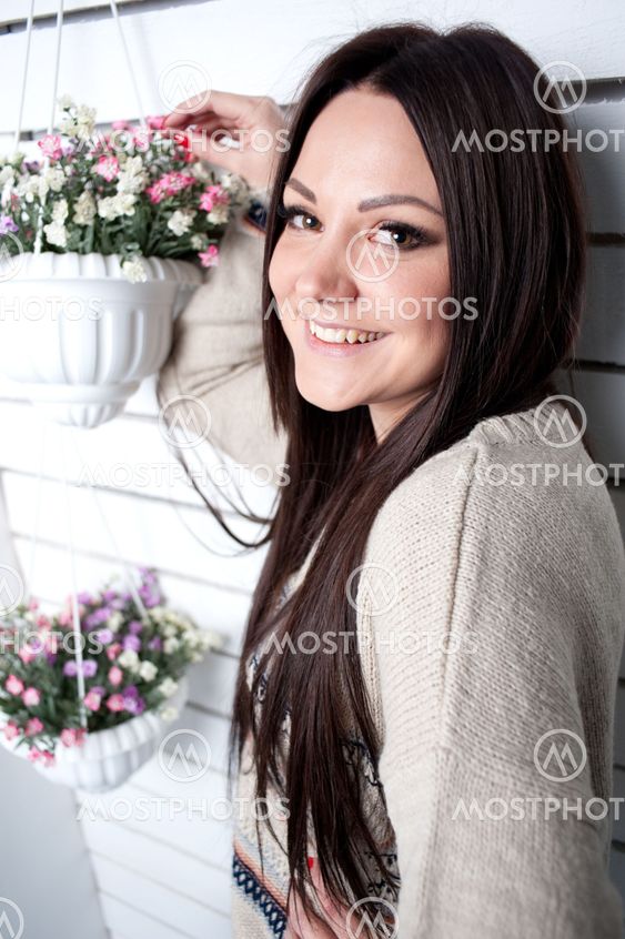 The young girl is engaged in flowers