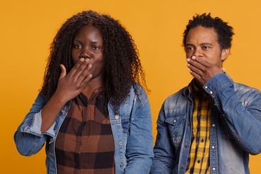 Cute romantic married couple sending air kisses and...