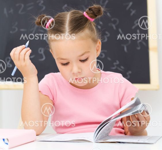 Little girl is studying