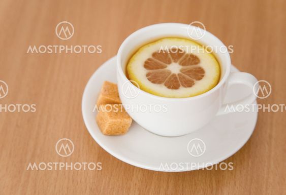 Cup of black tea with lemon and sugar