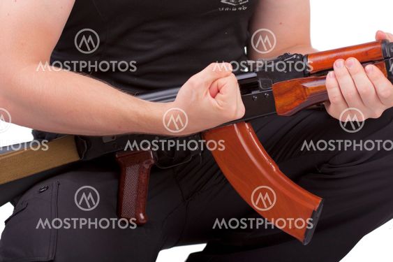 hands of man with rifle