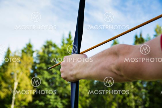 Man is ready to shoot from bow
