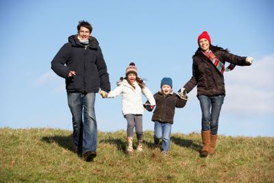 Family Running In The Park