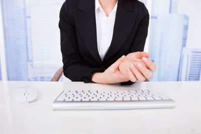 Businesswoman Suffering From Wrist Pain