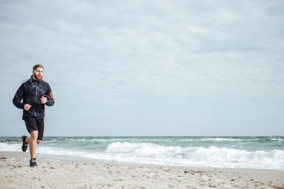 Runner running near the sea