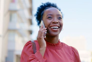 Black woman, phone call and commute to work, city and...