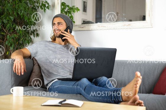 Handsome young business man working at home