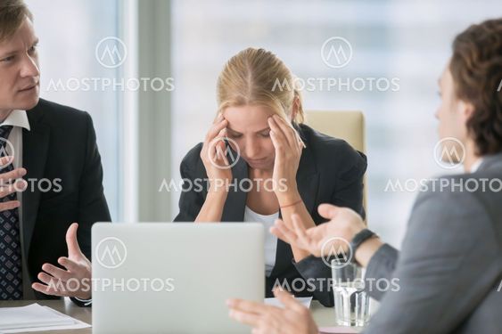 Stressing atmosphere at business meeting