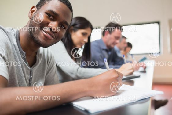 Man looking up from a lecture