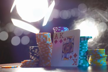 Poker game set of cards and chips close up