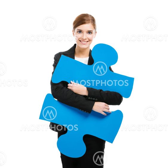 Businesswoman with a puzzle piece