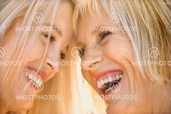 Mom and daughter laughing.
