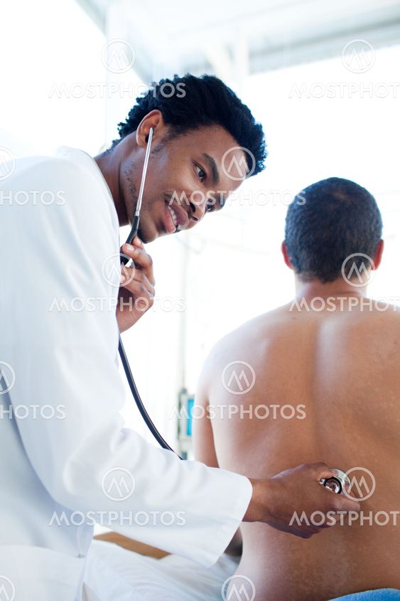 Attractive doctor attending a patient