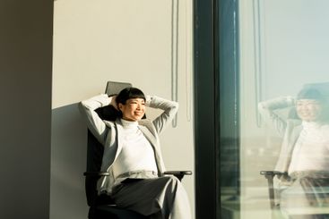 Relaxing in the sunlight while enjoying a moment of...