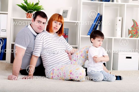 pregnant mother, father and baby, home decor