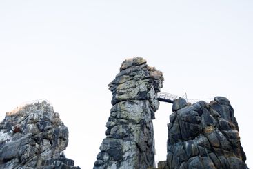 Large rocky rocks on a background of water. Rocks of...