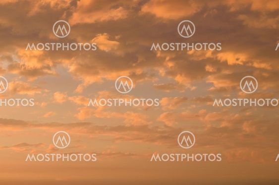 Fiery orange cloudscape, sundown background