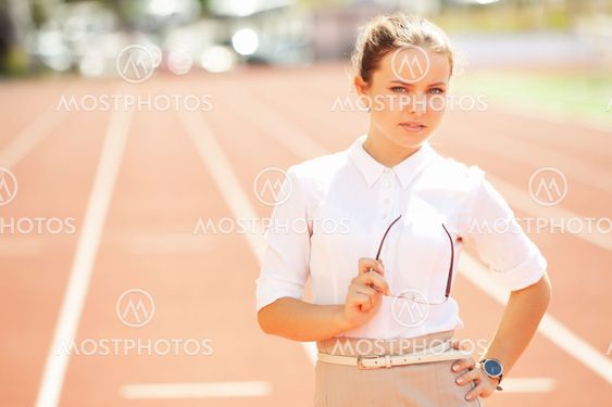 Business woman at athletic stadium