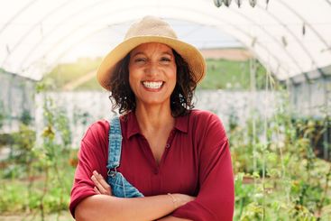 Agriculture, greenhouse and portrait of woman on farm...